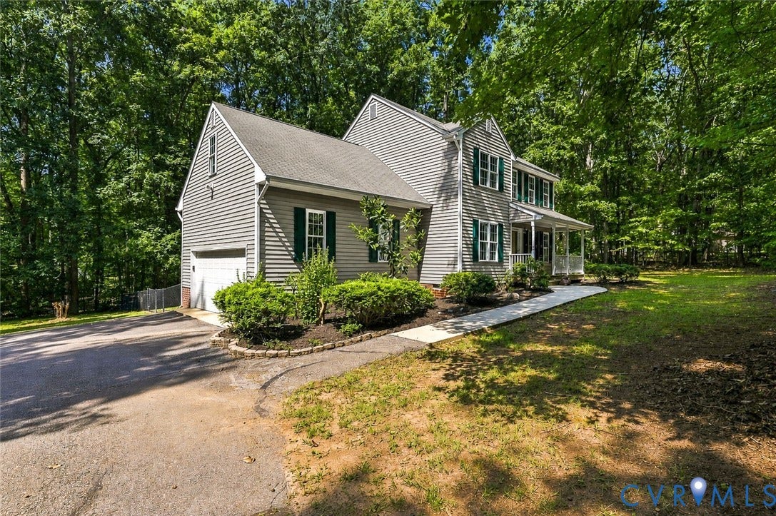 3522 Fairfield Road, Powhatan, VA 23139 Colonial-style residence with vinyl siding exterior, multi-gable roofline, and front-facing covered porch