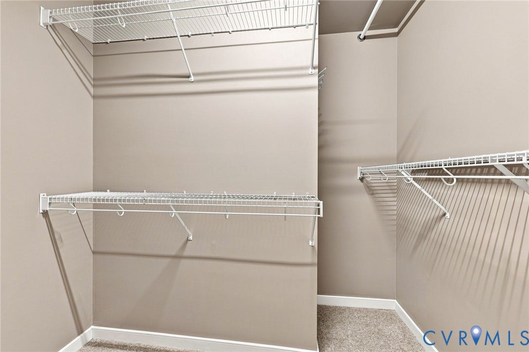 3522 Fairfield Road, Powhatan, VA 23139 Wall-to-wall carpeting and white wire shelving with integrated hanging rods