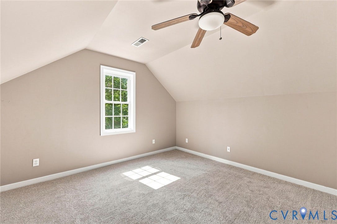 3522 Fairfield Road, Powhatan, VA 23139 Vaulted ceiling room with recessed window, wood-finish ceiling fan, and gray carpeting