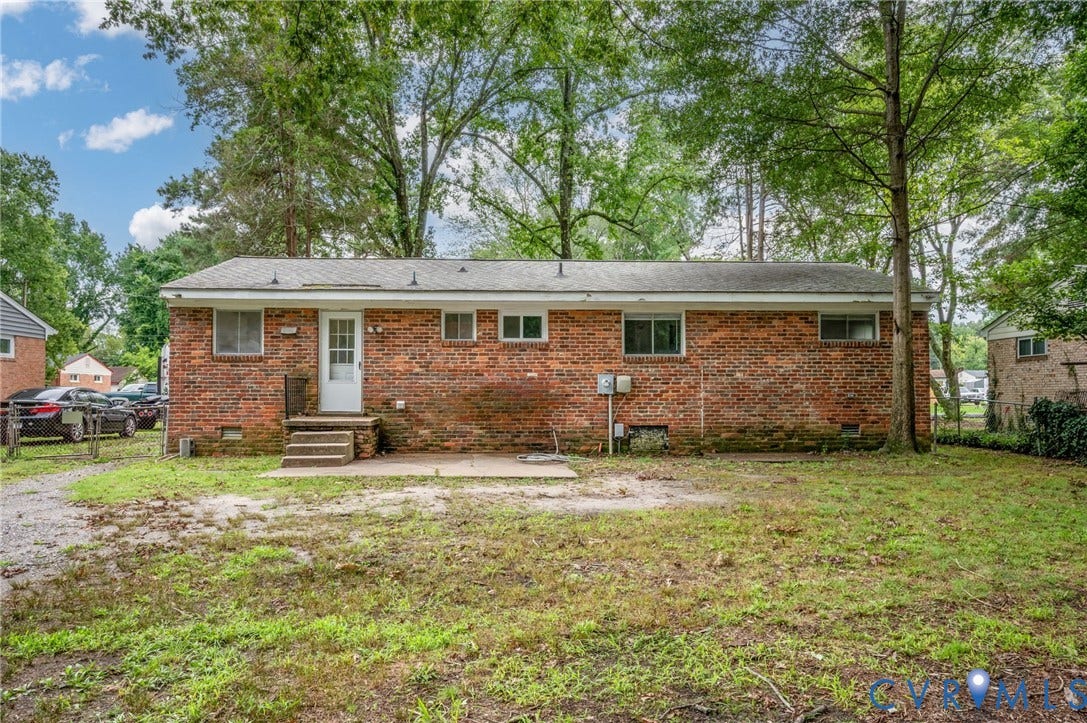 5322 Germain Road, Piney Knolls, Richmond, VA 23224 Brick exterior featuring multiple windows and a rear entry door with steps