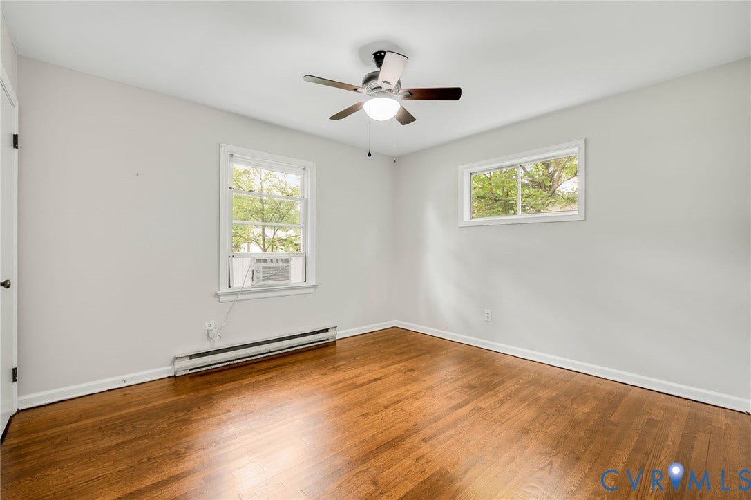 5322 Germain Road, Piney Knolls, Richmond, VA 23224 Wood-finish flooring, white painted walls, and a ceiling fan with integrated lighting