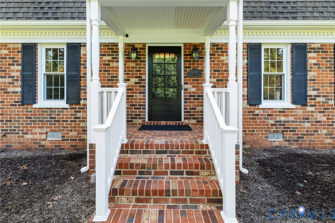 14411 Galloway Court, Salisbury, Midlothian, VA 23113 Brick exterior featuring a covered porch with white columns, a dark panel door with glass inserts, and white window frames with dark shutters