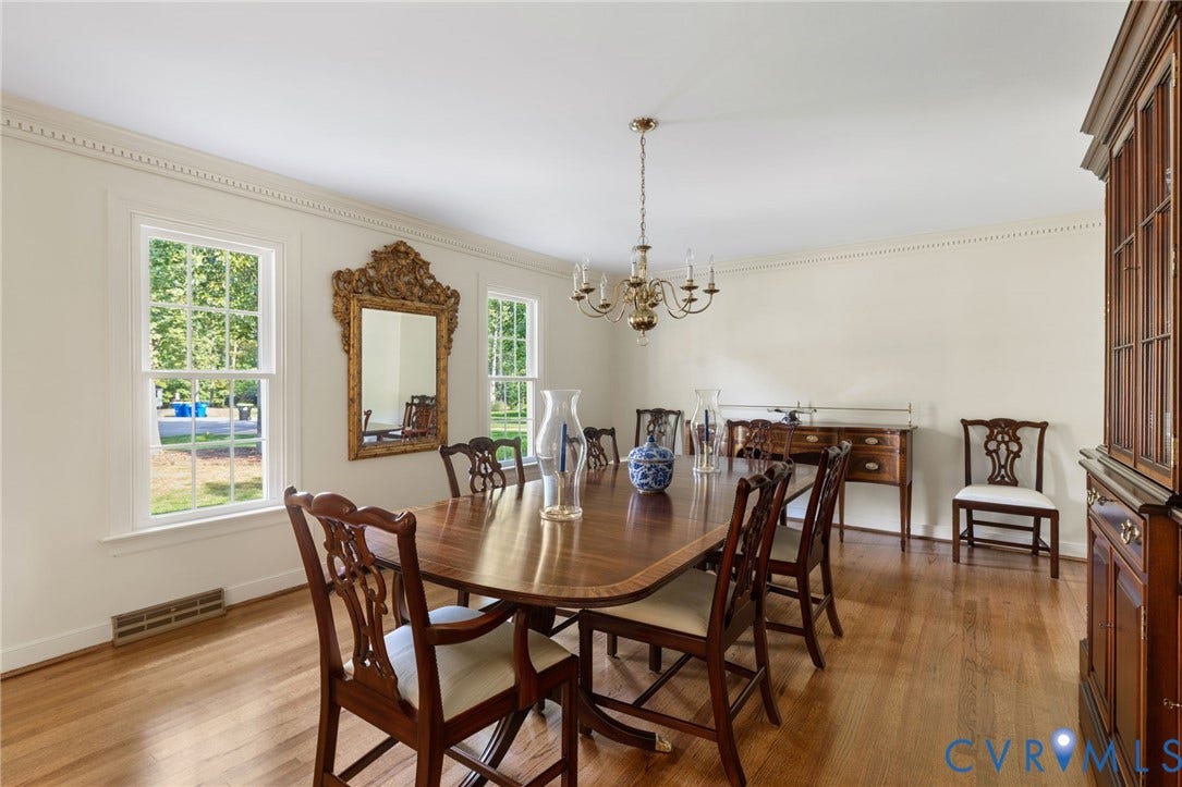 14411 Galloway Court, Salisbury, Midlothian, VA 23113 Hardwood flooring, crown molding, decorative chandelier, built-in display cabinet, and a built-in sideboard
