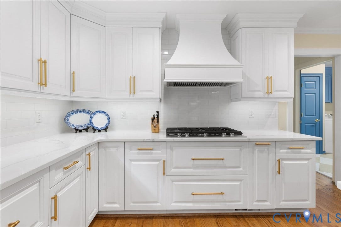 14411 Galloway Court, Salisbury, Midlothian, VA 23113 White shaker-style cabinetry with gold-tone hardware, white subway tile backsplash, white countertops, and a built-in gas range