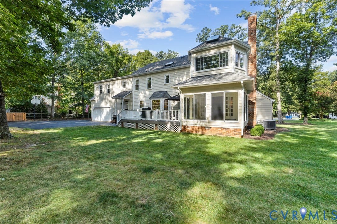 14411 Galloway Court, Salisbury, Midlothian, VA 23113 Expansive rear exterior featuring a multi-level deck, a sunroom with brick foundation, a two-story bay window element, and a prominent brick chimney