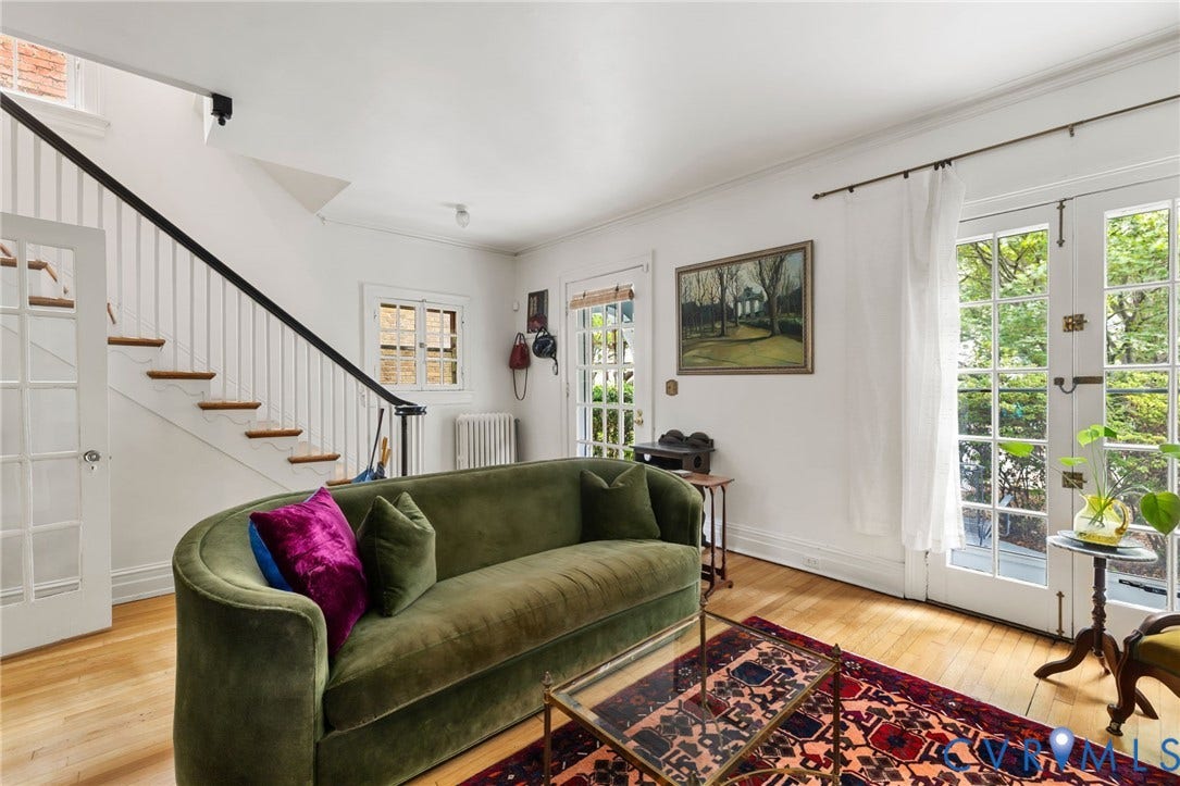 2415 Maplewood Avenue, Byrd Park, Richmond, VA 23220 Hardwood flooring, white walls, and a staircase with white risers and a black handrail