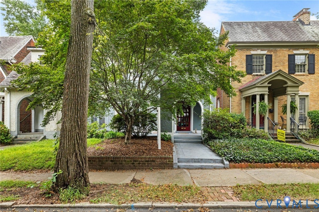 2415 Maplewood Avenue, Byrd Park, Richmond, VA 23220 Brick exterior with black window shutters and a covered porch entry