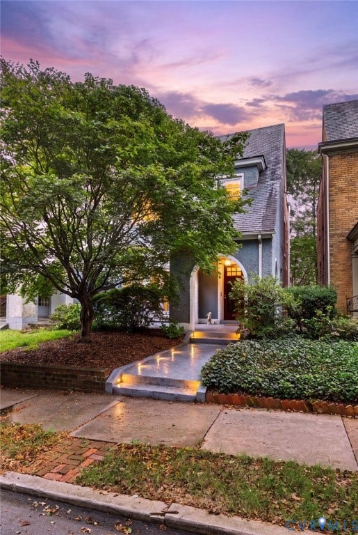 2415 Maplewood Avenue, Byrd Park, Richmond, VA 23220 Stucco facade residence with an arched entry, prominent dormer window, and mature front landscaping