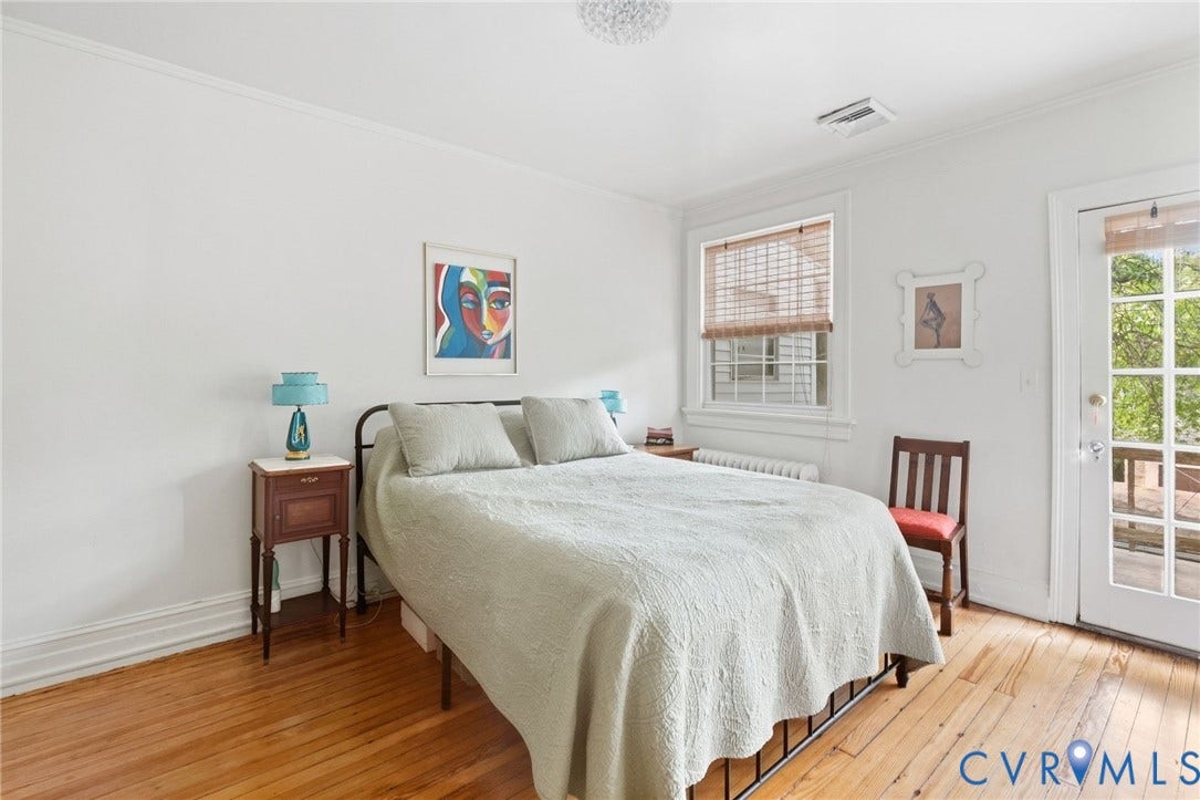2415 Maplewood Avenue, Byrd Park, Richmond, VA 23220 Hardwood flooring, painted white walls, white trim, glass-paned door, and a single window with blinds