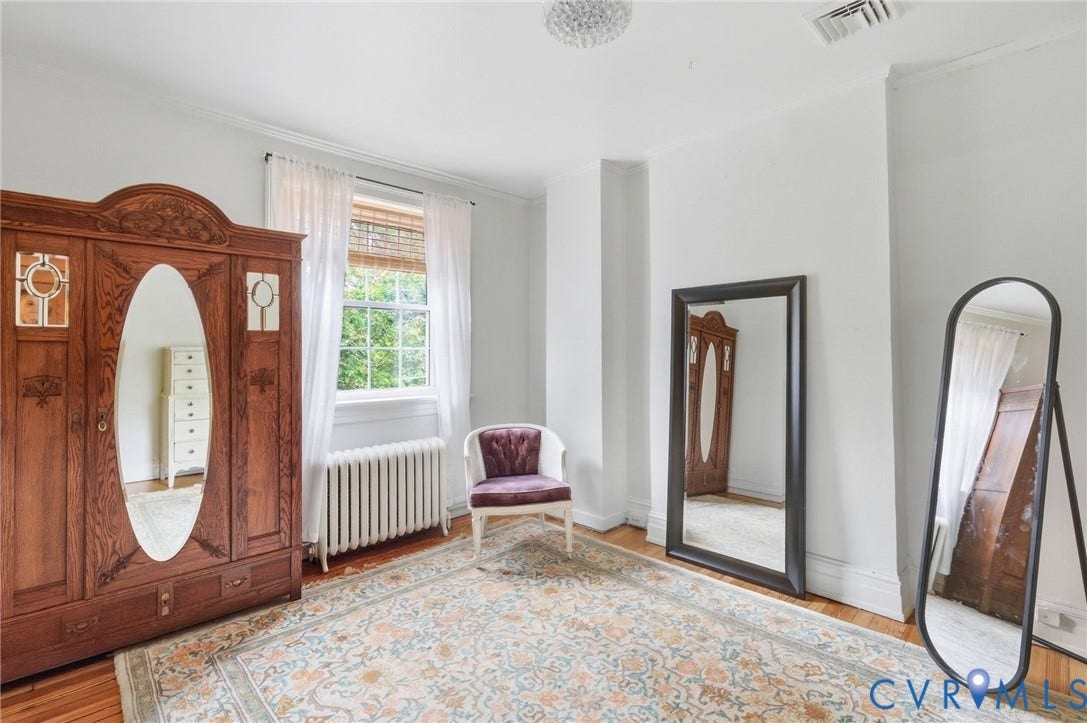 2415 Maplewood Avenue, Byrd Park, Richmond, VA 23220 Hardwood flooring, painted white walls, single window with blinds, and crown molding
