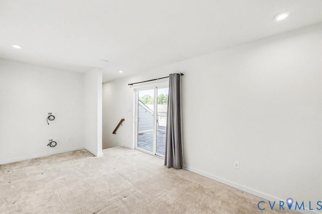 1141 Broad Hill Trace, Saunders Station Townes, Henrico, VA 23233 Recessed lighting, light-toned carpeting, white walls, sliding glass door, and a partial wood handrail