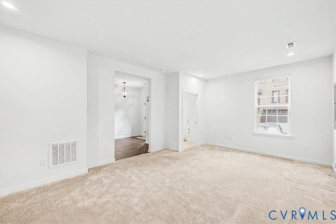 1141 Broad Hill Trace, Saunders Station Townes, Henrico, VA 23233 Neutral wall finishes, recessed lighting, carpet flooring, and a single-pane window