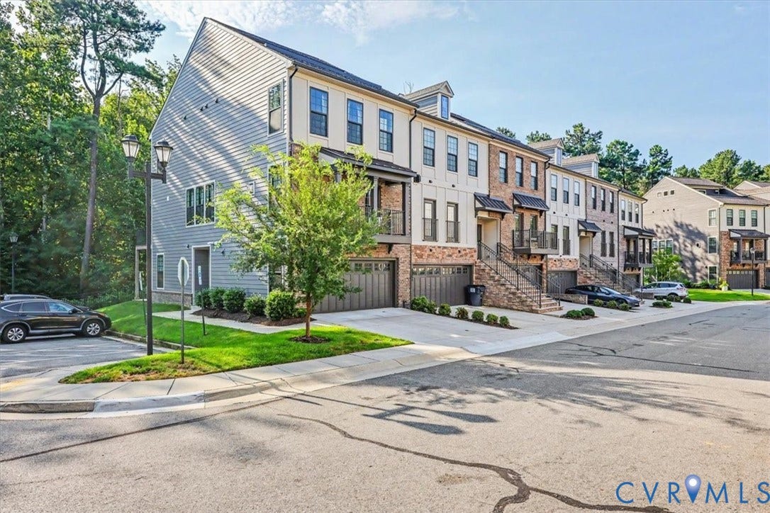 1141 Broad Hill Trace, Saunders Station Townes, Henrico, VA 23233 Modern townhome community featuring brick and siding exteriors, private garages, individual driveways, and landscaped grounds