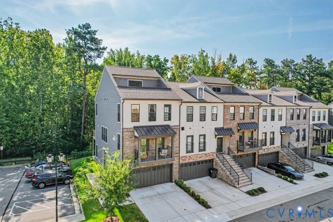 1141 Broad Hill Trace, Saunders Station Townes, Henrico, VA 23233 Modern townhome architecture featuring mixed material facade, integrated garage parking, private balconies, and mature tree-lined surroundings