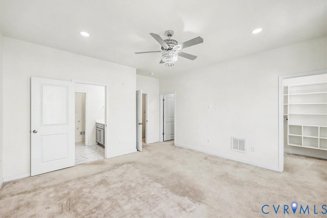 1141 Broad Hill Trace, Saunders Station Townes, Henrico, VA 23233 Recessed lighting, ceiling fan with chandelier detail, white walls, built-in shelving, and light-toned carpeting