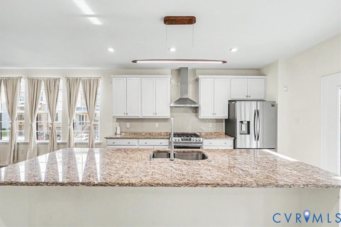 1141 Broad Hill Trace, Saunders Station Townes, Henrico, VA 23233 Kitchen featuring an expansive island with granite countertops, stainless steel appliances, white cabinetry, and recessed lighting