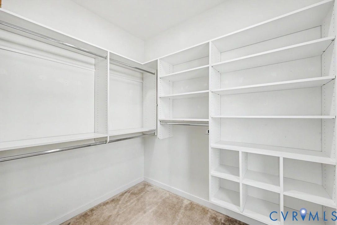 1141 Broad Hill Trace, Saunders Station Townes, Henrico, VA 23233 Custom closet system featuring white shelving and chrome hanging rods