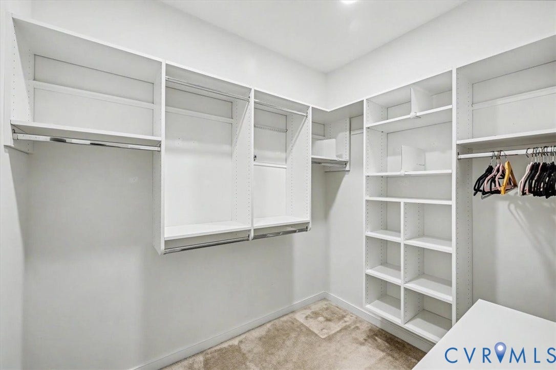 1141 Broad Hill Trace, Saunders Station Townes, Henrico, VA 23233 Built-in white shelving system with multiple hanging rods and recessed lighting
