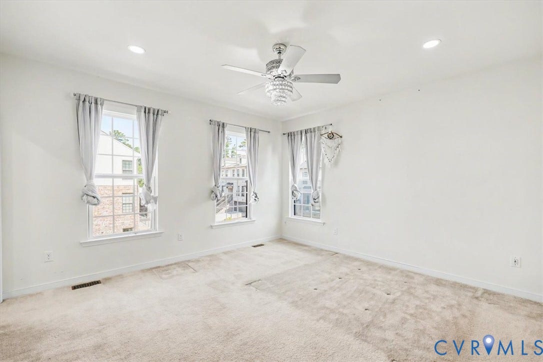 1141 Broad Hill Trace, Saunders Station Townes, Henrico, VA 23233 Recessed ceiling lighting, ceiling fan with light fixture, three large windows, light-toned carpet, and neutral wall tones