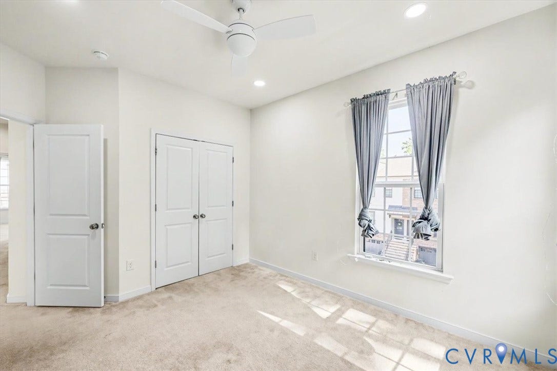 1141 Broad Hill Trace, Saunders Station Townes, Henrico, VA 23233 Neutral wall paint, plush carpeting, ceiling fan, recessed lighting, and a double-door closet