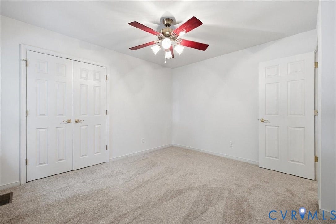 Neutral-toned carpeting throughout