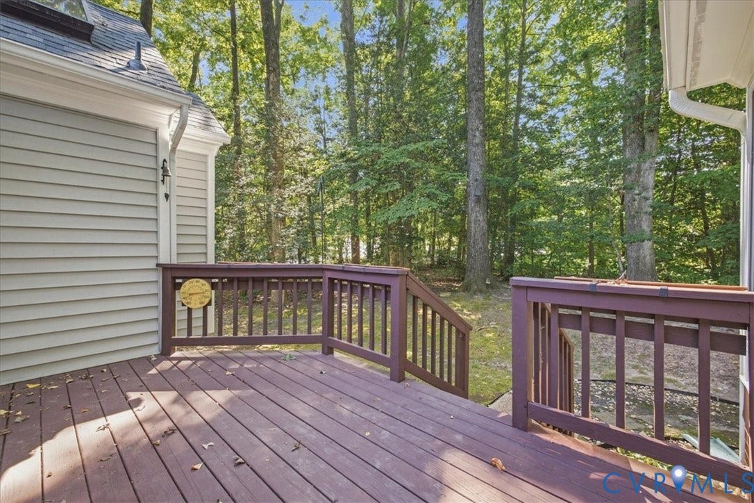 Outdoor deck with wood-finish flooring and railing