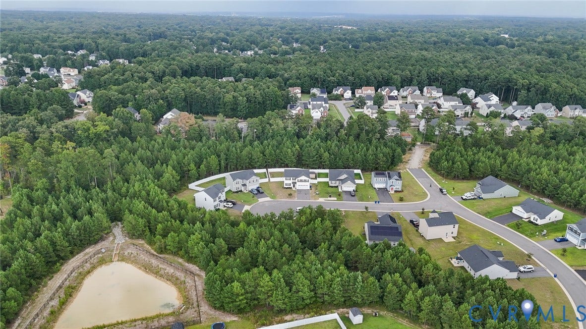 5713 Bison Ford Court, Chesterfield, VA 23234 Residential community featuring extensive tree coverage, curved streets, and a pond