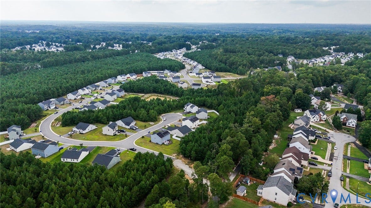 5713 Bison Ford Court, Chesterfield, VA 23234 Residential development featuring multiple single-family homes surrounded by mature trees