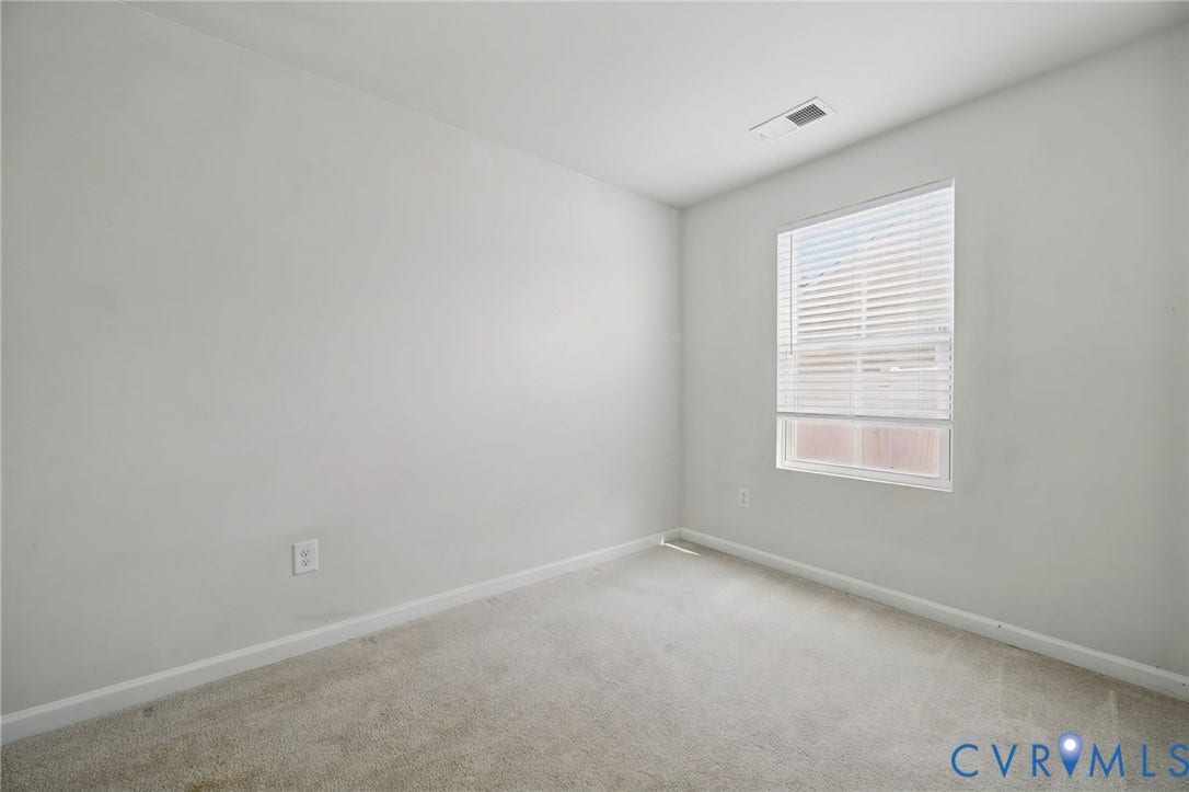 5713 Bison Ford Court, Chesterfield, VA 23234 Neutral toned walls, single window with blinds, and carpeted flooring
