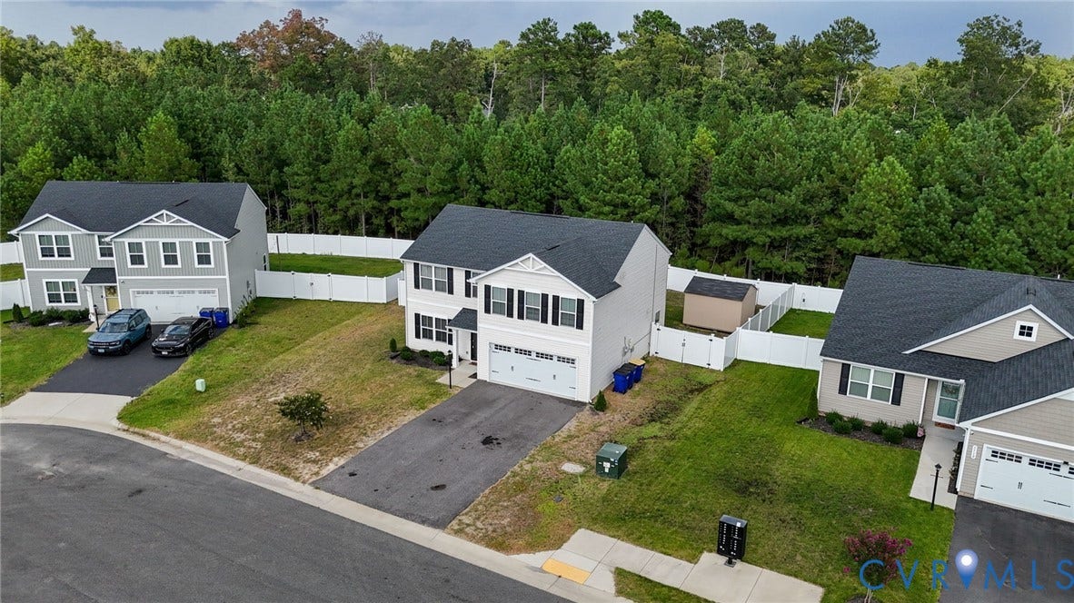 5713 Bison Ford Court, Chesterfield, VA 23234 Two-story residence with a dark shingle roof, light-colored siding, and white trim