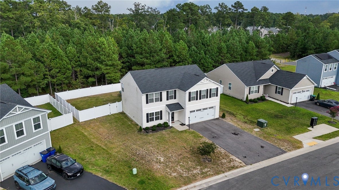 5713 Bison Ford Court, Chesterfield, VA 23234 Two-story dwelling with an attached garage, white siding, and dark shutters