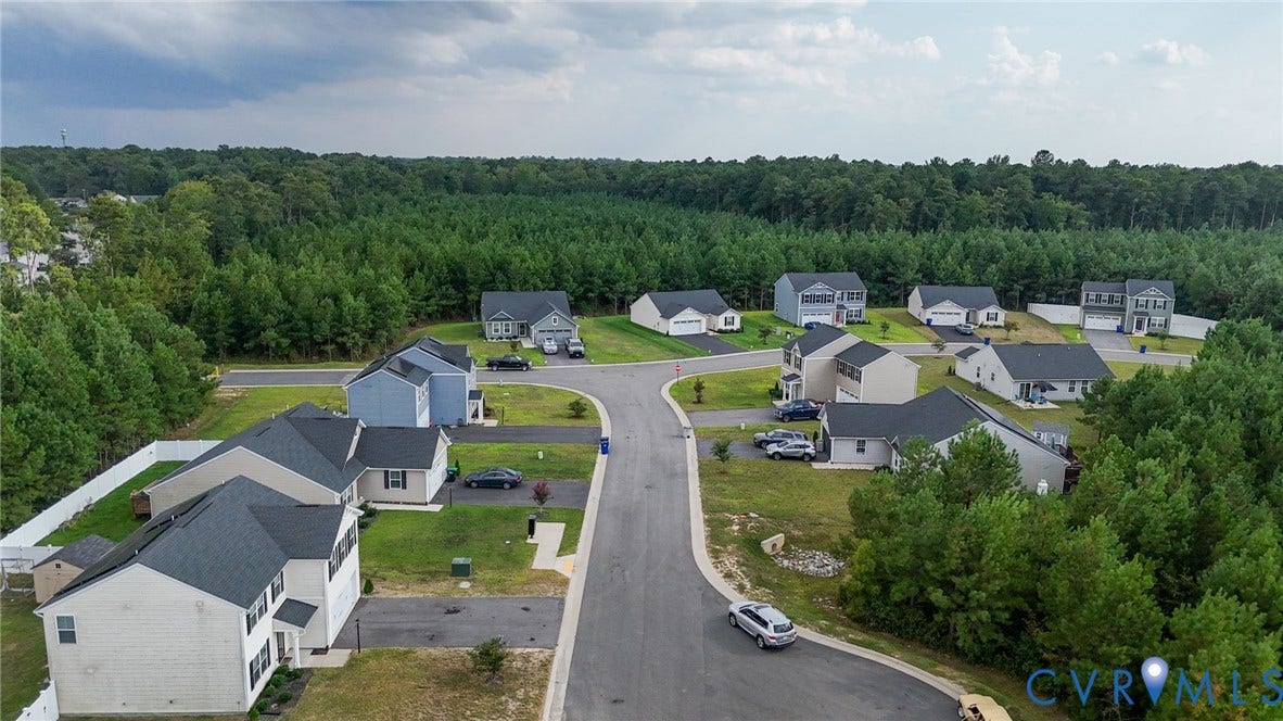5713 Bison Ford Court, Chesterfield, VA 23234 Residential street with paved road, surrounded by mature trees
