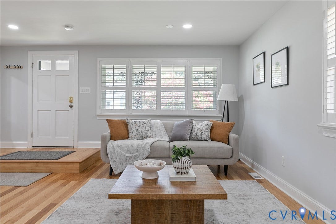 2203 Wedgewood Avenue, Henrico, VA 23228 Recessed lighting, wood-finish flooring, white paneled entry door with glass inserts, white plantation shutters, and a floating wood-finish entryway step