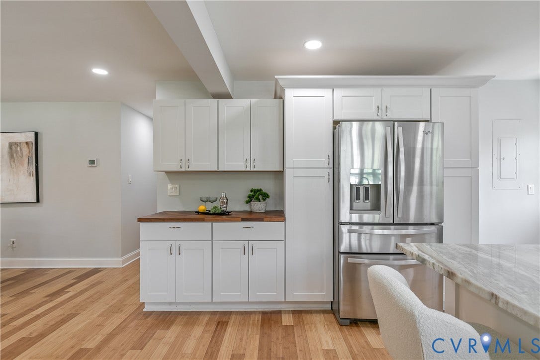 2203 Wedgewood Avenue, Henrico, VA 23228 Recessed lighting, wood-finish flooring, white cabinetry with crown molding, wood countertops, and a stainless steel refrigerator