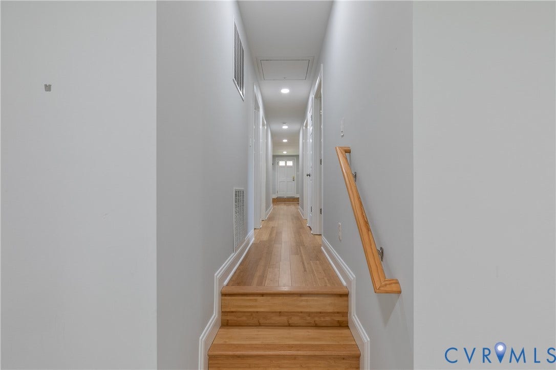 2203 Wedgewood Avenue, Henrico, VA 23228 Hardwood flooring and staircase with natural wood handrail