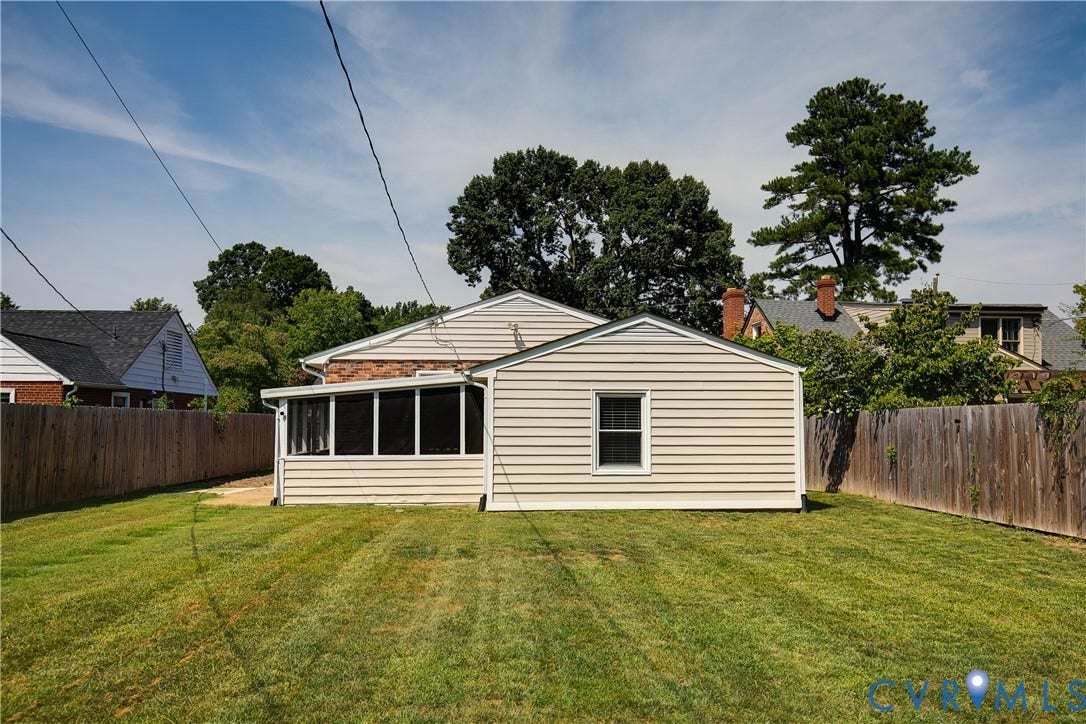 2203 Wedgewood Avenue, Henrico, VA 23228 Expansive grassy yard with wood fencing and a screened-in porch