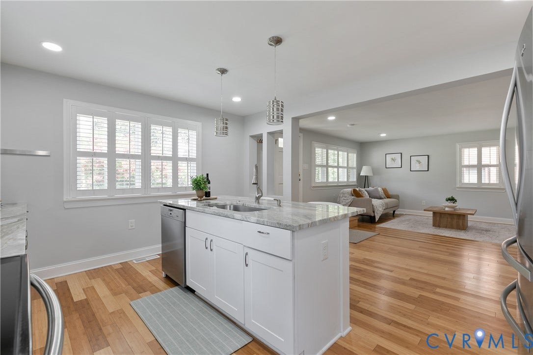 2203 Wedgewood Avenue, Henrico, VA 23228 Kitchen island featuring a double-basin sink, stainless steel dishwasher, and pendant lighting