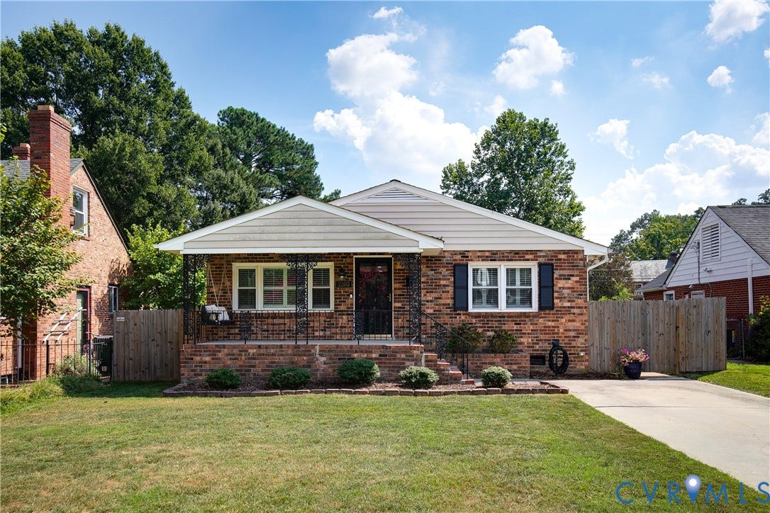 2203 Wedgewood Avenue, Henrico, VA 23228 Brick exterior with white siding accents and a covered front porch featuring wrought iron railing