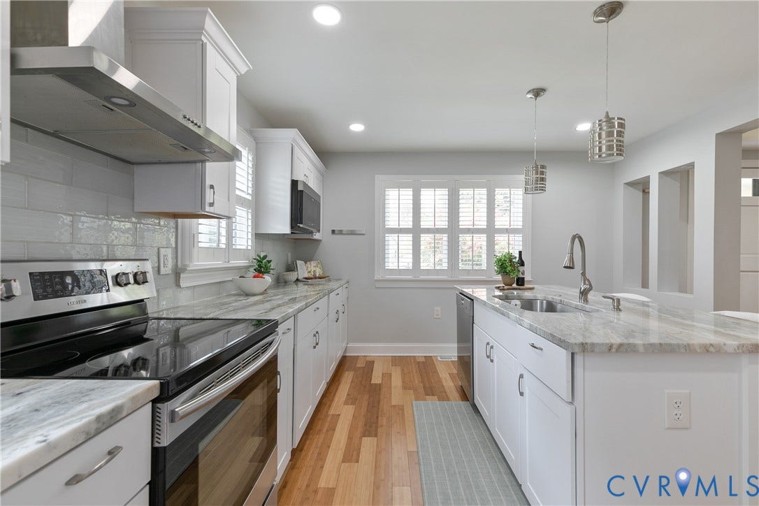 2203 Wedgewood Avenue, Henrico, VA 23228 Kitchen featuring white cabinetry, light-toned countertops, stainless steel appliances, wood-finish flooring, and recessed lighting