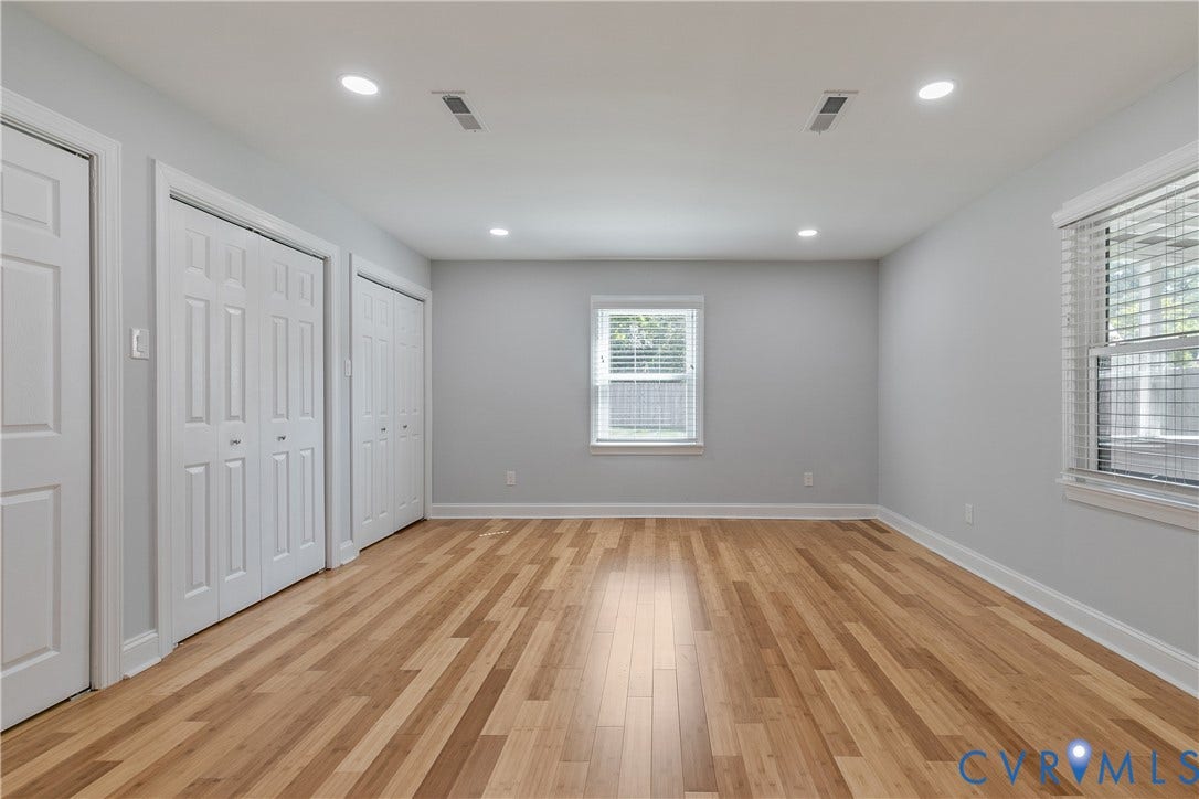 2203 Wedgewood Avenue, Henrico, VA 23228 Wood-finish flooring, recessed lighting, and multiple windows with blinds