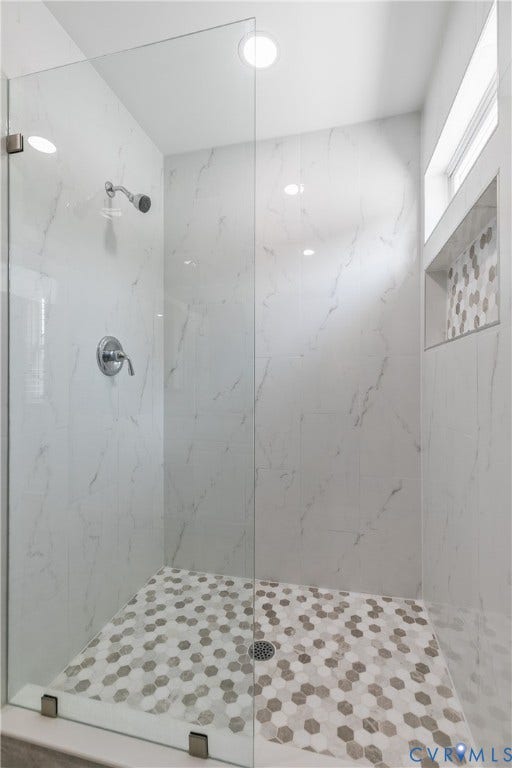 2203 Wedgewood Avenue, Henrico, VA 23228 Enclosed shower with clear glass panels, large format wall tiling, hexagonal floor tiling, recessed lighting, and a tiled shower niche