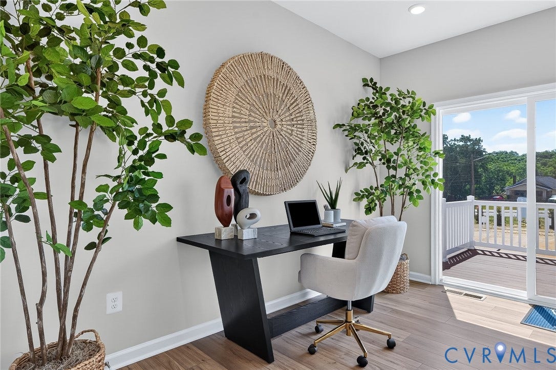6138 Hull Street Road, Richmond, VA 23224 Recessed lighting, light-toned wall paint, wood-finish flooring, sliding glass door, and exterior decking with white railing