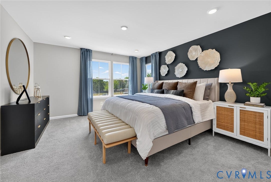 6138 Hull Street Road, Richmond, VA 23224 Recessed lighting, light gray carpet flooring, large windows with blue drapery, accent wall, and a headboard