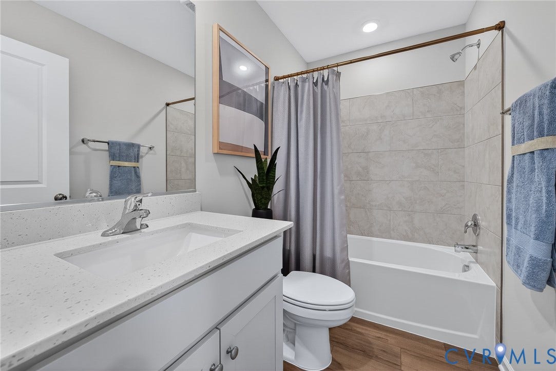6138 Hull Street Road, Richmond, VA 23224 Vanity with integrated sink and chrome faucet