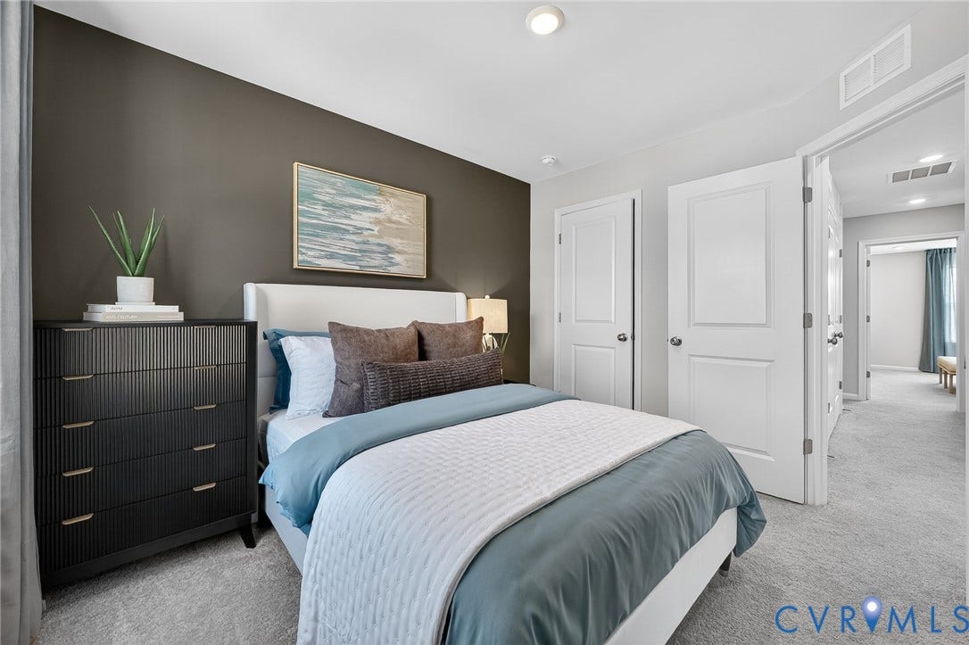 6138 Hull Street Road, Richmond, VA 23224 Neutral-toned walls with a contrasting accent wall, recessed ceiling lighting, and light-colored carpeting