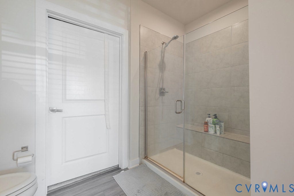 4000 Maze Runner Drive, #101, Midlothian, VA 23112 Glass-enclosed shower with tile surround and built-in shelf