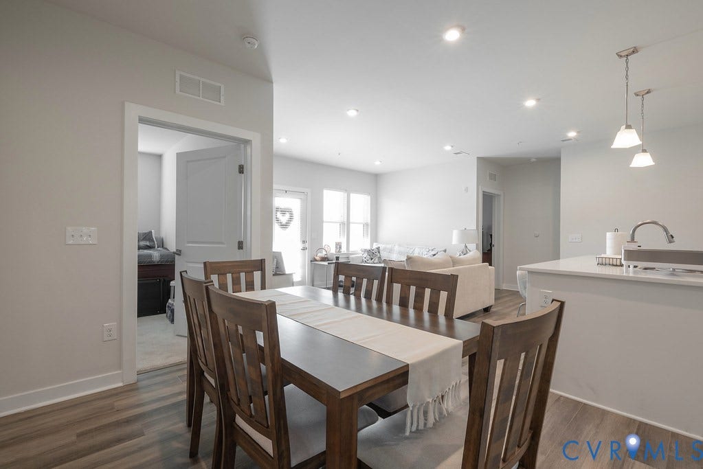 4000 Maze Runner Drive, #101, Midlothian, VA 23112 Open-concept living space featuring wood-finish flooring, recessed lighting, and a kitchen island with pendant lighting