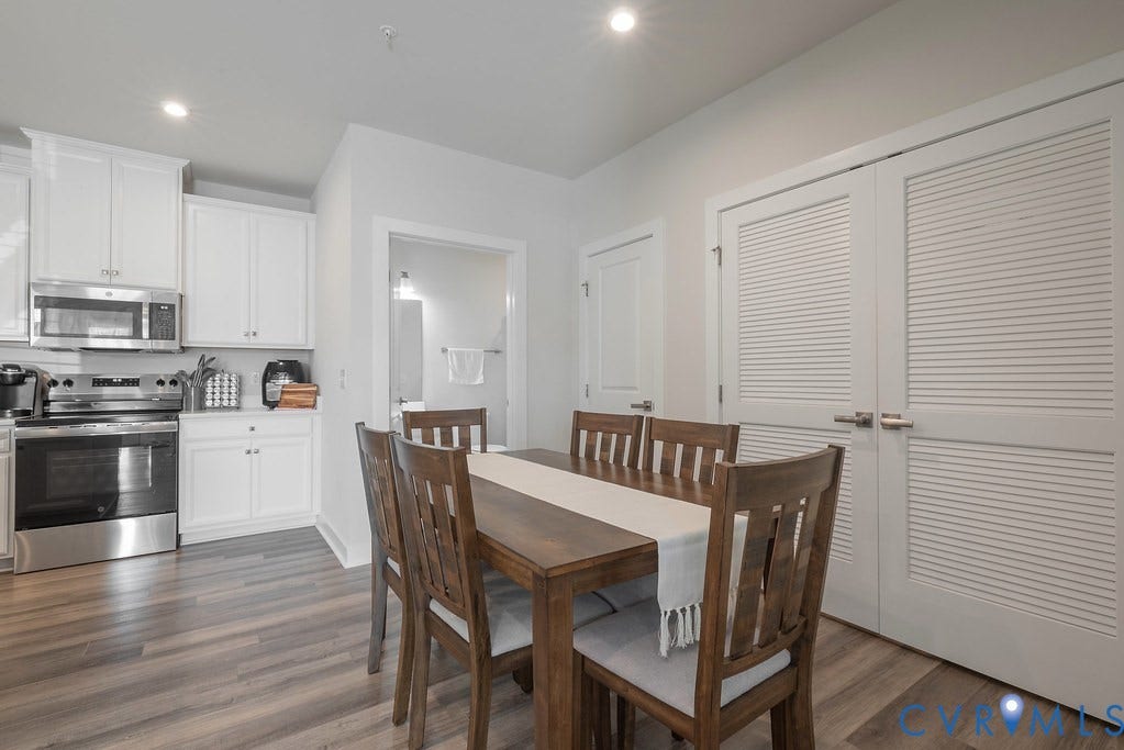 4000 Maze Runner Drive, #101, Midlothian, VA 23112 Kitchen featuring white cabinetry, stainless steel appliances, and wood-finish flooring