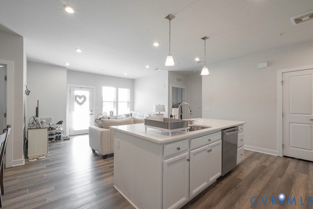4000 Maze Runner Drive, #101, Midlothian, VA 23112 Open-concept living space featuring wood-finish flooring, recessed lighting, and a kitchen island with pendant lighting
