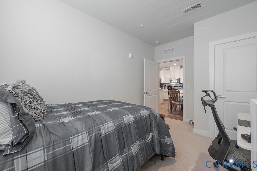4000 Maze Runner Drive, #101, Midlothian, VA 23112 Light-colored walls with trim, white interior doors, and light-colored carpeting